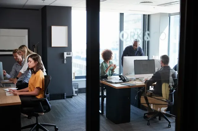 Young creative team working together at computers