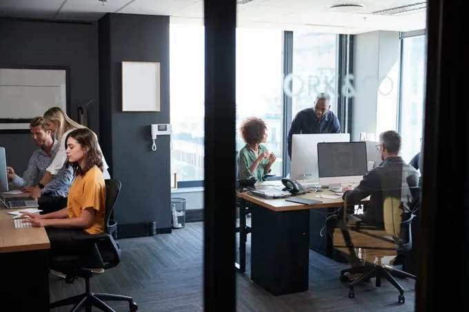 Young creative team working together at computers