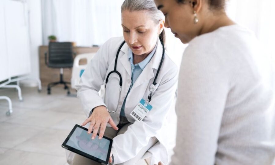 Doctor woman patient and tablet for hospital cons